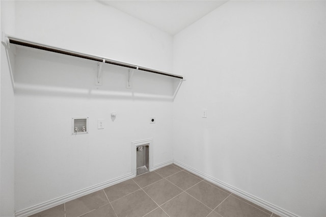 clothes washing area featuring hookup for a gas dryer, hookup for a washing machine, electric dryer hookup, and light tile patterned floors