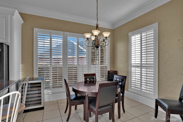 dining room with ornamental molding, a chandelier, wine cooler, and light tile patterned floors