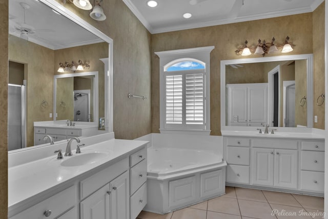 bathroom with tile patterned flooring, ceiling fan, ornamental molding, vanity, and a bathtub