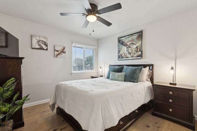 bedroom featuring ceiling fan and light hardwood / wood-style flooring