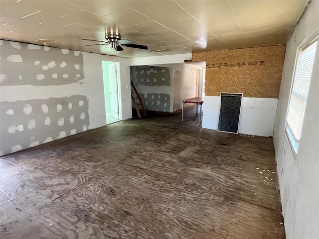 unfurnished living room with ceiling fan