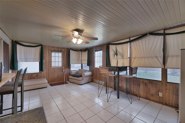 sunroom / solarium featuring wooden ceiling and ceiling fan