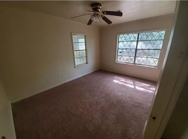 carpeted empty room with ceiling fan