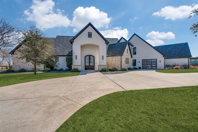 view of front of house featuring french doors and a front yard