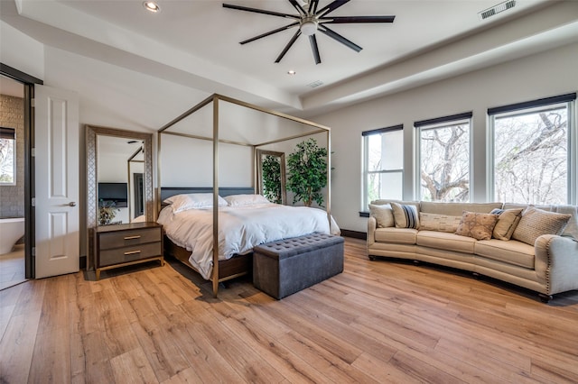 bedroom with light wood-type flooring and ceiling fan