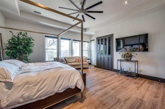 bedroom featuring light hardwood / wood-style floors and ceiling fan