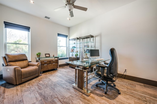 office space with ceiling fan