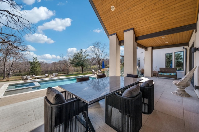 view of pool featuring a patio area, an outdoor living space, and an in ground hot tub