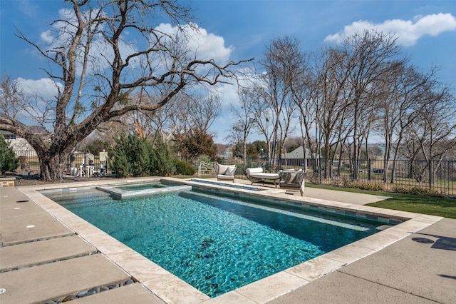 view of swimming pool featuring an in ground hot tub and a patio area