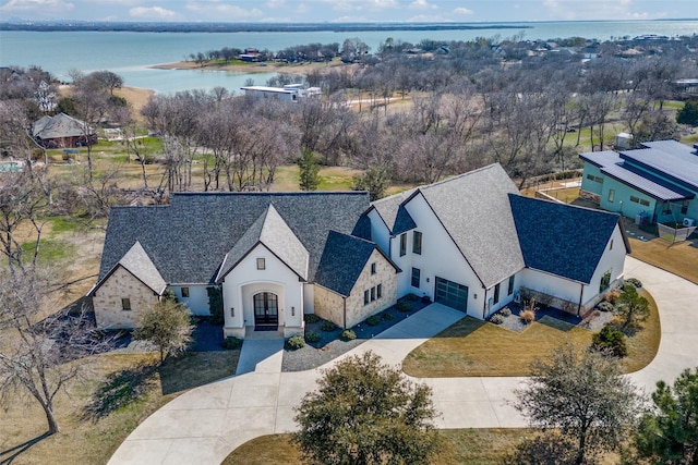 birds eye view of property featuring a water view