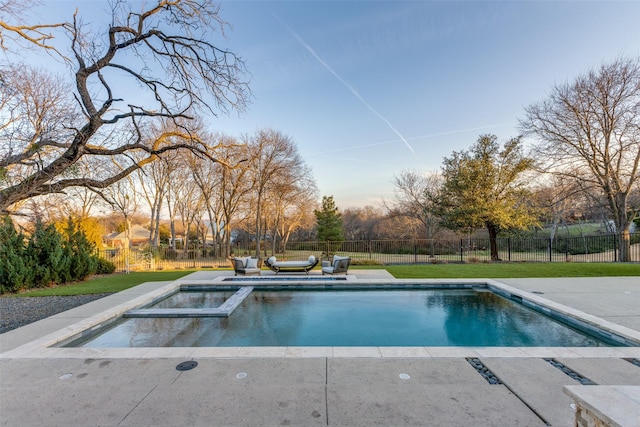 view of swimming pool featuring a yard and an in ground hot tub