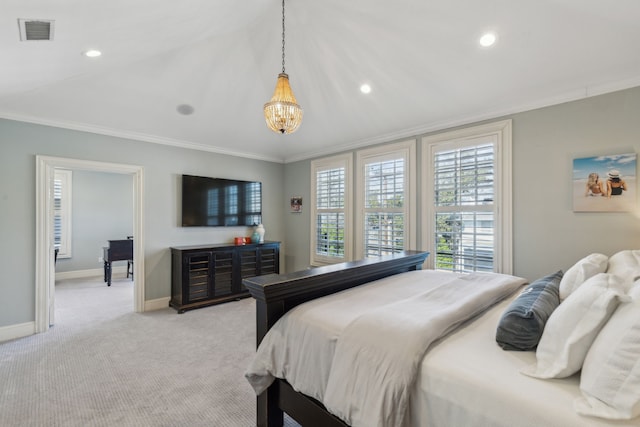 carpeted bedroom featuring crown molding