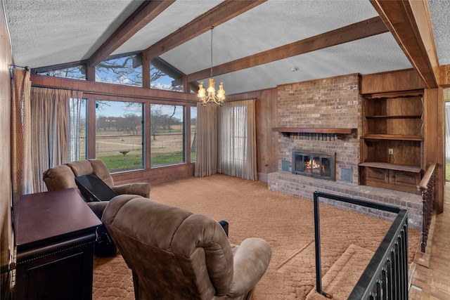 carpeted living room featuring a fireplace, an inviting chandelier, lofted ceiling with beams, a textured ceiling, and wooden walls