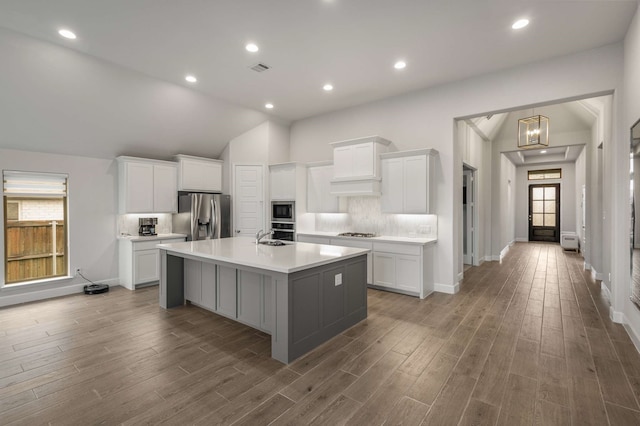 5716 Turner May Dr, Fort Worth, TX 76126 - kitchen with appliances with stainless steel finishes, light countertops, white cabinets, lofted ceiling, and recessed lighting