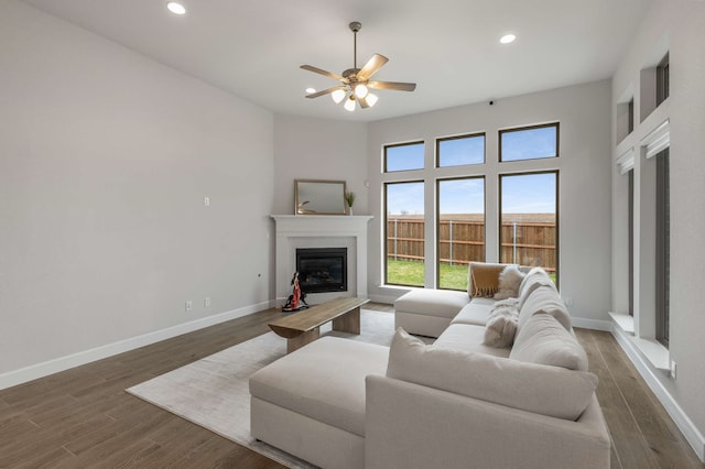 5716 Turner May Dr, Fort Worth, TX 76126 - living room featuring a glass covered fireplace, baseboards, ceiling fan, recessed lighting, and wood finished floors