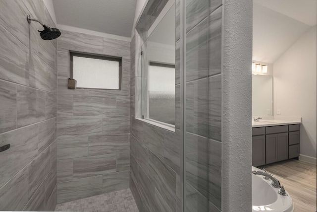 5716 Turner May Dr, Fort Worth, TX 76126 - full bathroom featuring tiled shower, vanity, and wood finished floors