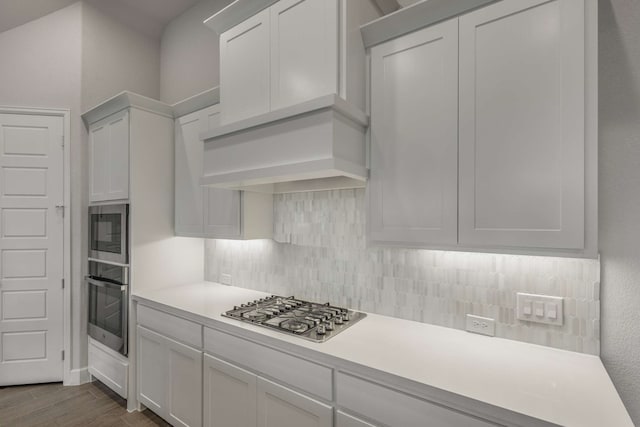 5716 Turner May Dr, Fort Worth, TX 76126 - kitchen featuring stainless steel appliances, backsplash, light countertops, dark wood-type flooring, and white cabinets