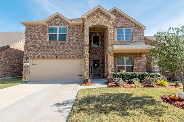 view of front of house with a front lawn and a garage