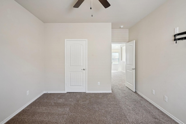 unfurnished bedroom featuring carpet and ceiling fan