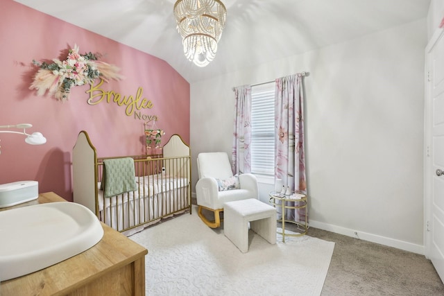 bedroom featuring carpet floors, sink, a chandelier, and a nursery area