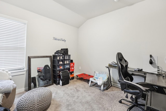 carpeted office space featuring vaulted ceiling and a wealth of natural light