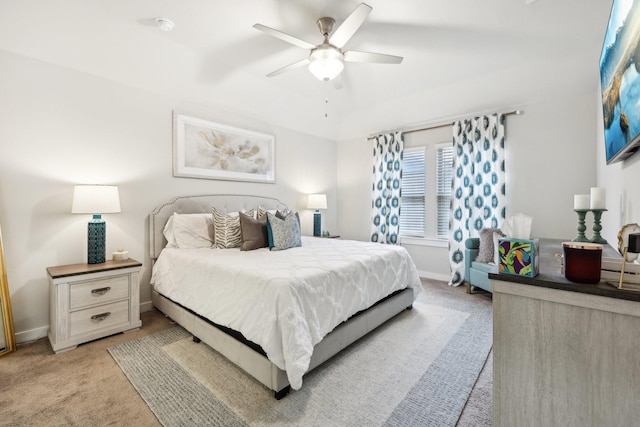 bedroom featuring ceiling fan and light carpet