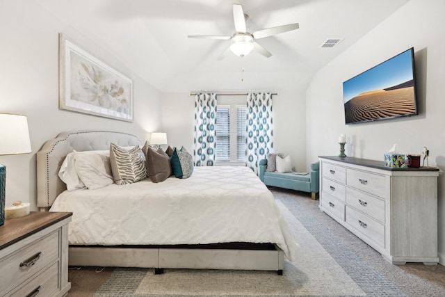 carpeted bedroom featuring ceiling fan and vaulted ceiling