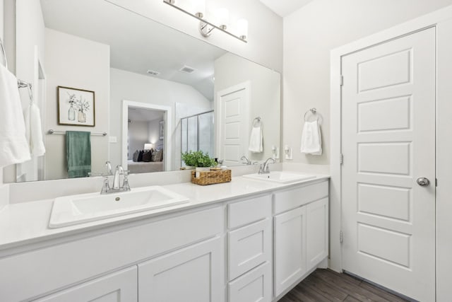 bathroom featuring hardwood / wood-style floors and vanity