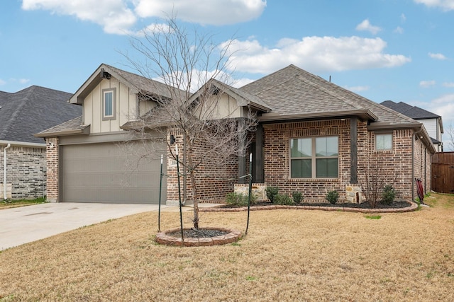 view of front of home with a garage and a front lawn