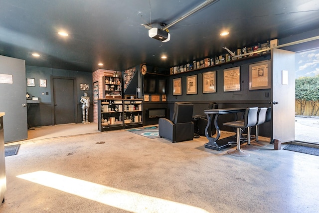 interior space with a garage door opener and recessed lighting