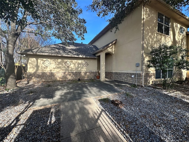 view of side of home with a garage