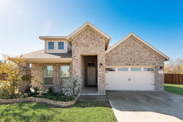 view of front facade featuring a garage and a front lawn