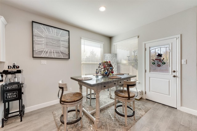 dining area featuring light wood-type flooring