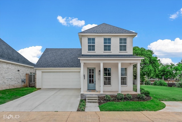 front facade featuring covered porch, a front lawn, and a garage