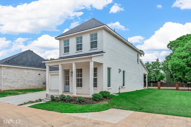 view of front of house with a garage, a front lawn, and a porch