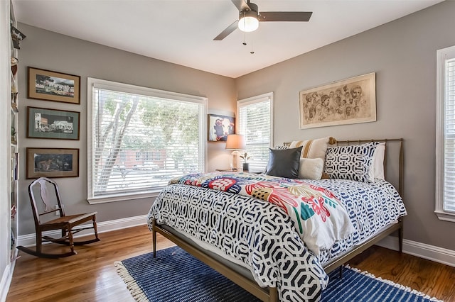 bedroom featuring hardwood / wood-style floors and ceiling fan