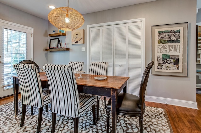 dining area with hardwood / wood-style flooring