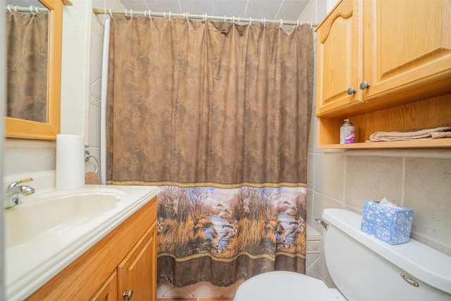 bathroom featuring curtained shower, vanity, and toilet