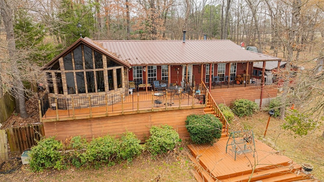 rear view of property with a deck