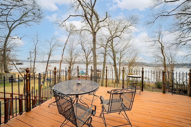 wooden terrace with a water view