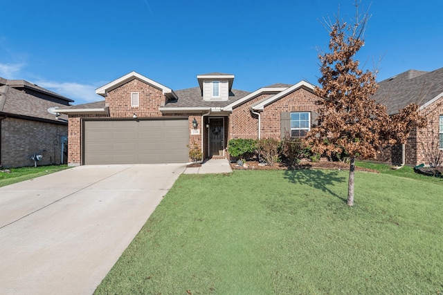 view of front of property featuring a front lawn and a garage