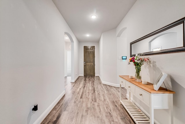 corridor featuring light hardwood / wood-style floors