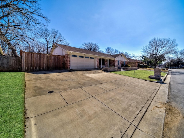 ranch-style house with a front yard and a garage