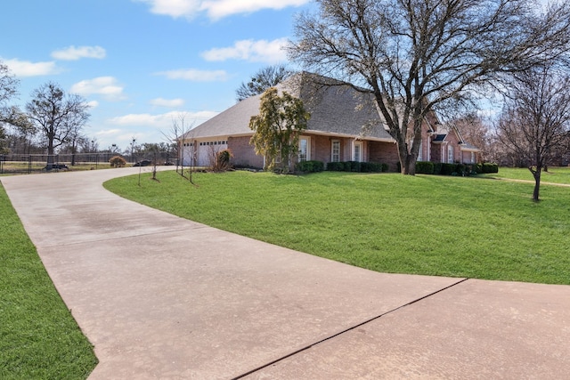 exterior space featuring a yard and a garage