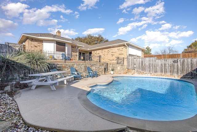 view of pool with a patio, a fenced backyard, and a fenced in pool