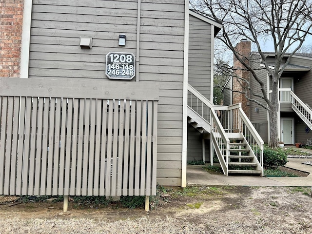 view of side of property with stairs