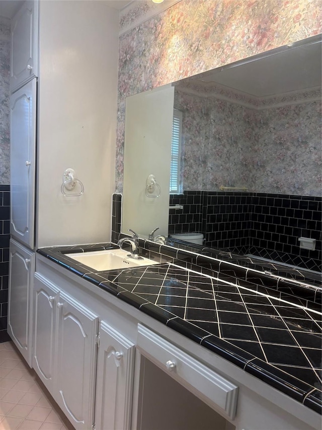 bathroom featuring vanity and tile patterned flooring