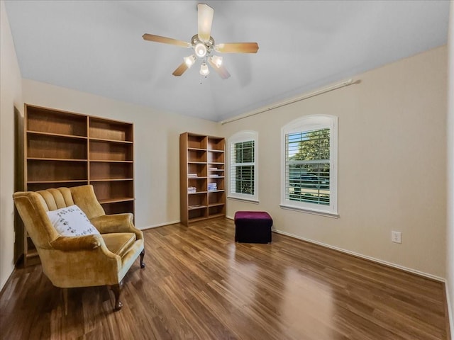 sitting room featuring hardwood / wood-style flooring, ceiling fan, and vaulted ceiling