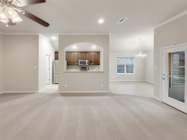 unfurnished living room with light carpet, crown molding, and ceiling fan with notable chandelier