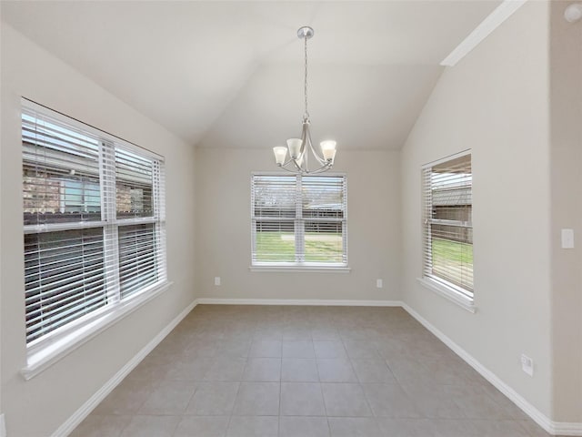 unfurnished room with light tile patterned floors, a chandelier, and vaulted ceiling